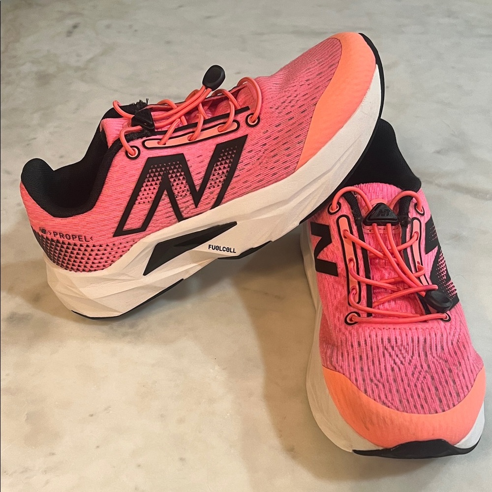 New Balance propel Coral and Black kids running shoes